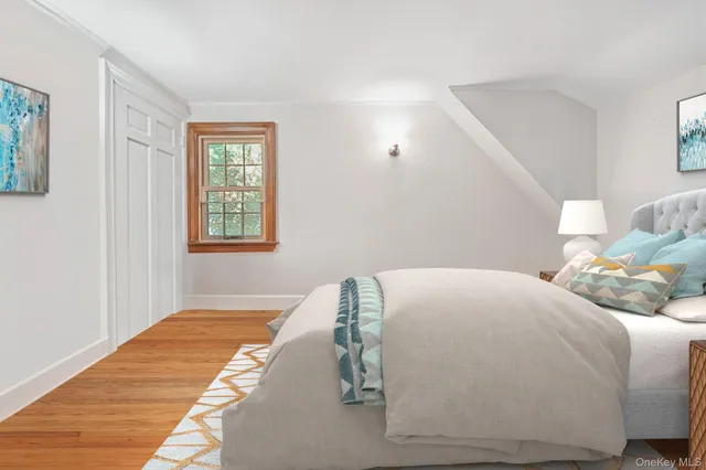 a bedroom with a bed and window