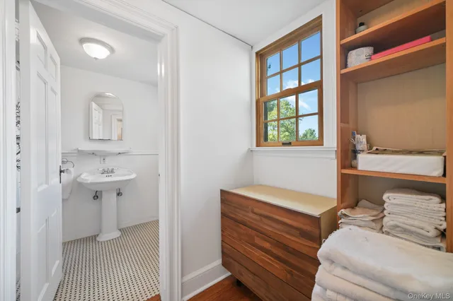 a en suite bathroom with a sink and a window