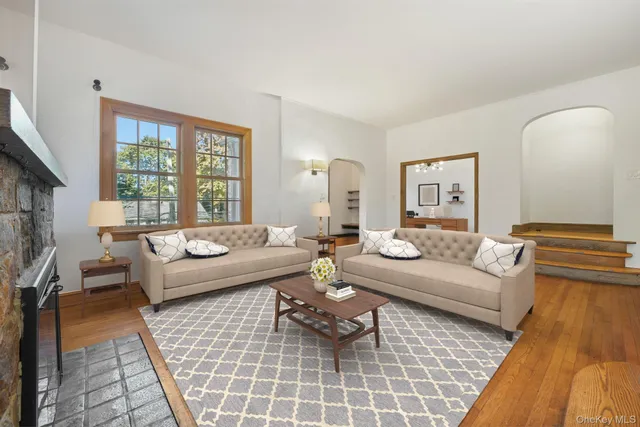 a living room with furniture and a rug