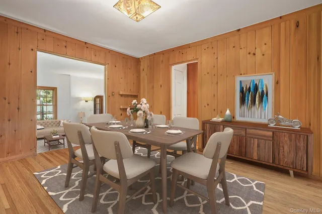 a view of a dining room with furniture and chandelier