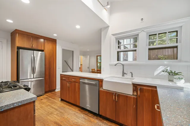 a kitchen with a sink stove and refrigerator