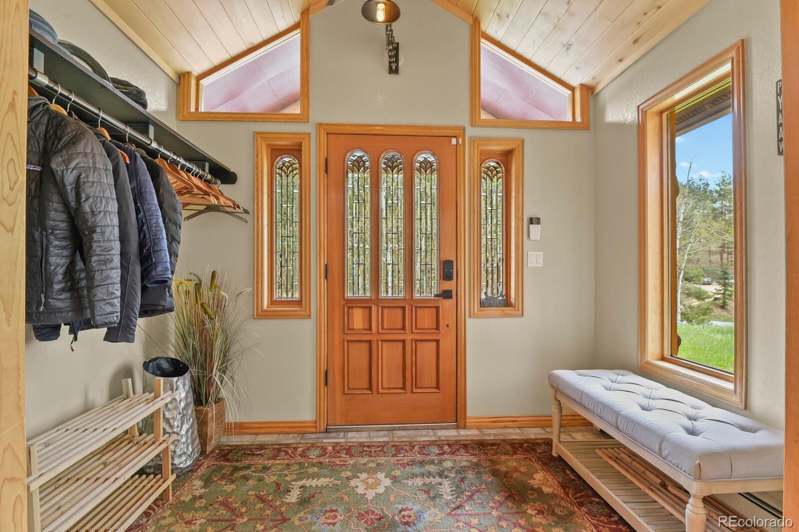 417 Witter Gulch Road Evergreen, CO 80439 - Photo 12 of 50 a view of an entryway with a front door