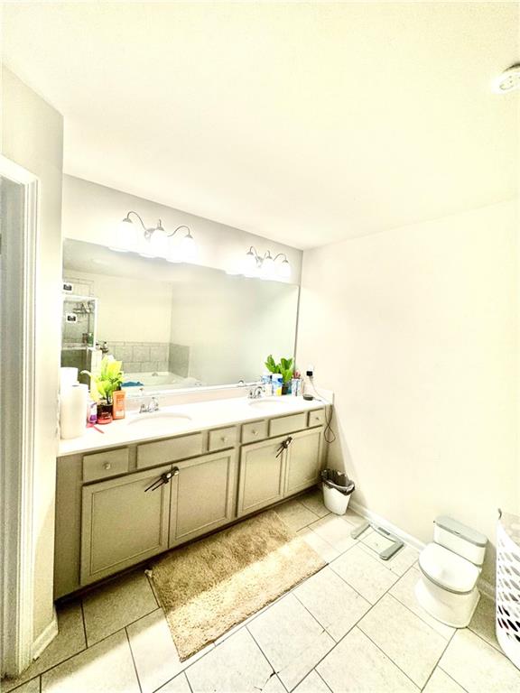 2188 Justify Lane, Unit 40 Lithonia, GA 30058 - Photo 15 of 21 a large bathroom with a sink mirror and a bathtub