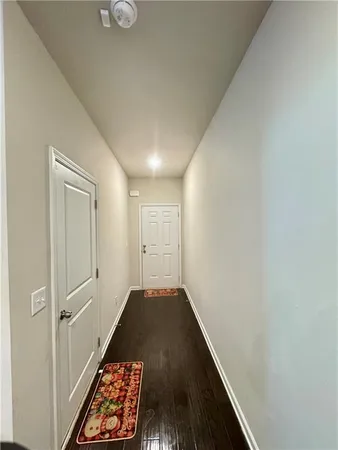 an empty room with wooden floor