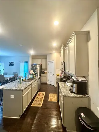 a kitchen with a stove and a refrigerator