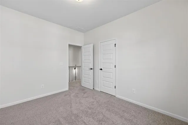 an empty room with closet area