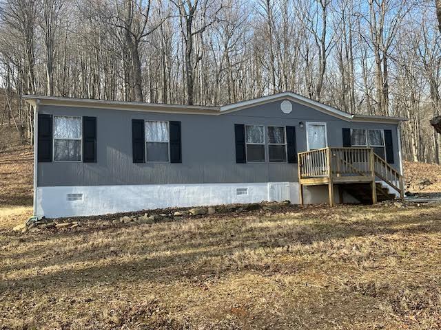 208 Summitt Ridge Drive Blue Ridge, VA 24064 - Photo 1 of 20 a house with trees in the background
