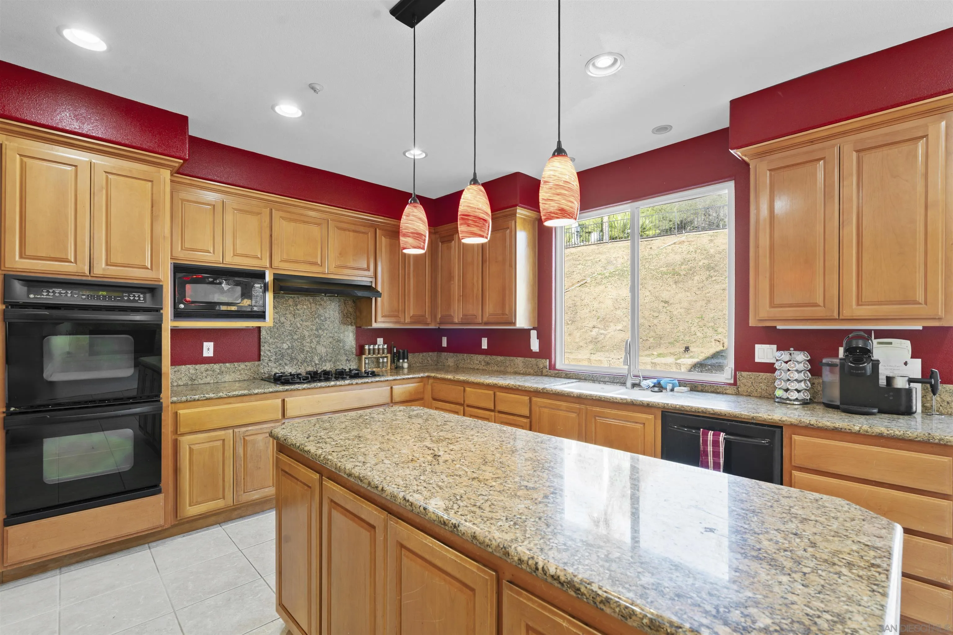 24534 Rutherford Road Ramona, CA 92065 - Photo 8 of 19 a kitchen with a sink a counter top space cabinets and a window