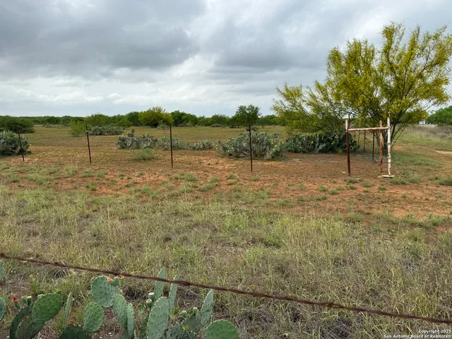 a view of a lake with houses in back