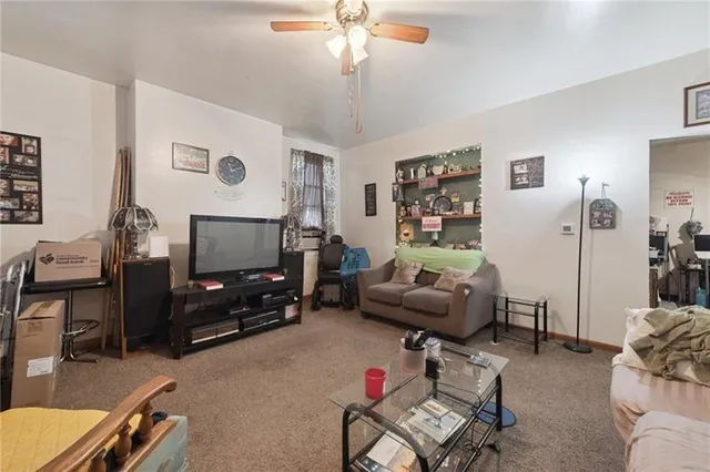 a dining room with furniture a chandelier and wooden floor