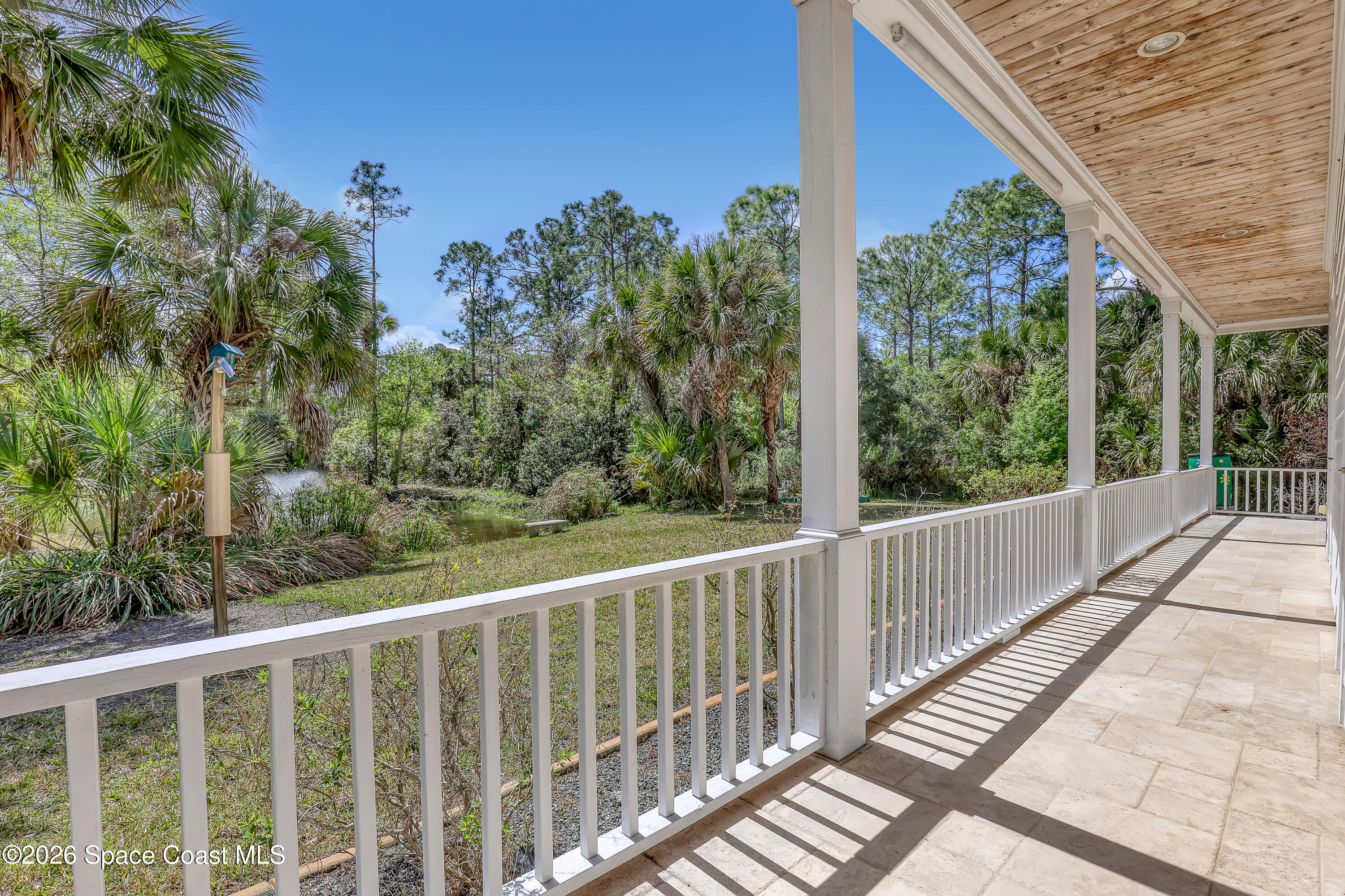 4200 Mustang Road Melbourne, FL 32934 - Photo 11 of 58 a view of a balcony with wooden floor