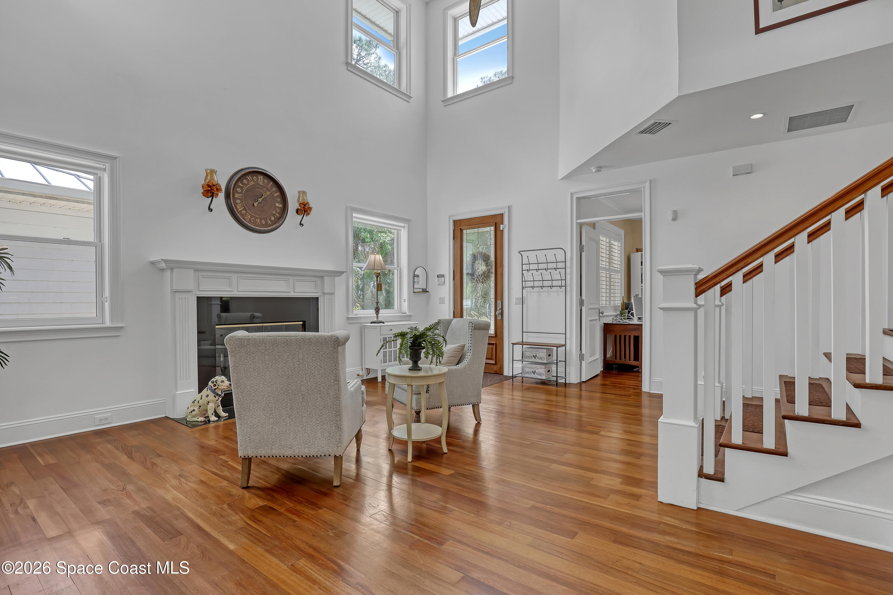 4200 Mustang Road Melbourne, FL 32934 - Photo 17 of 58 a living room with furniture and a fireplace