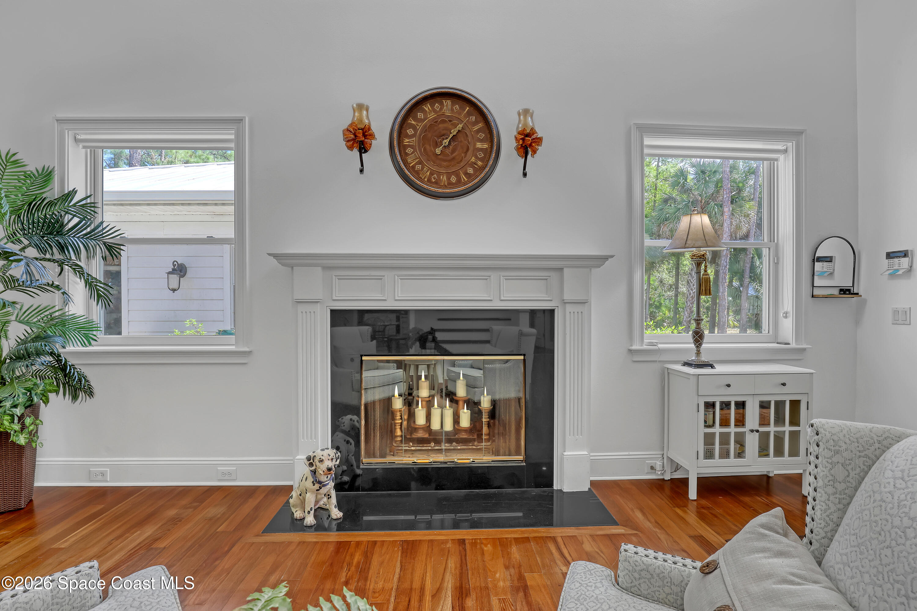 4200 Mustang Road Melbourne, FL 32934 - Photo 18 of 58 a living room with furniture and a fireplace