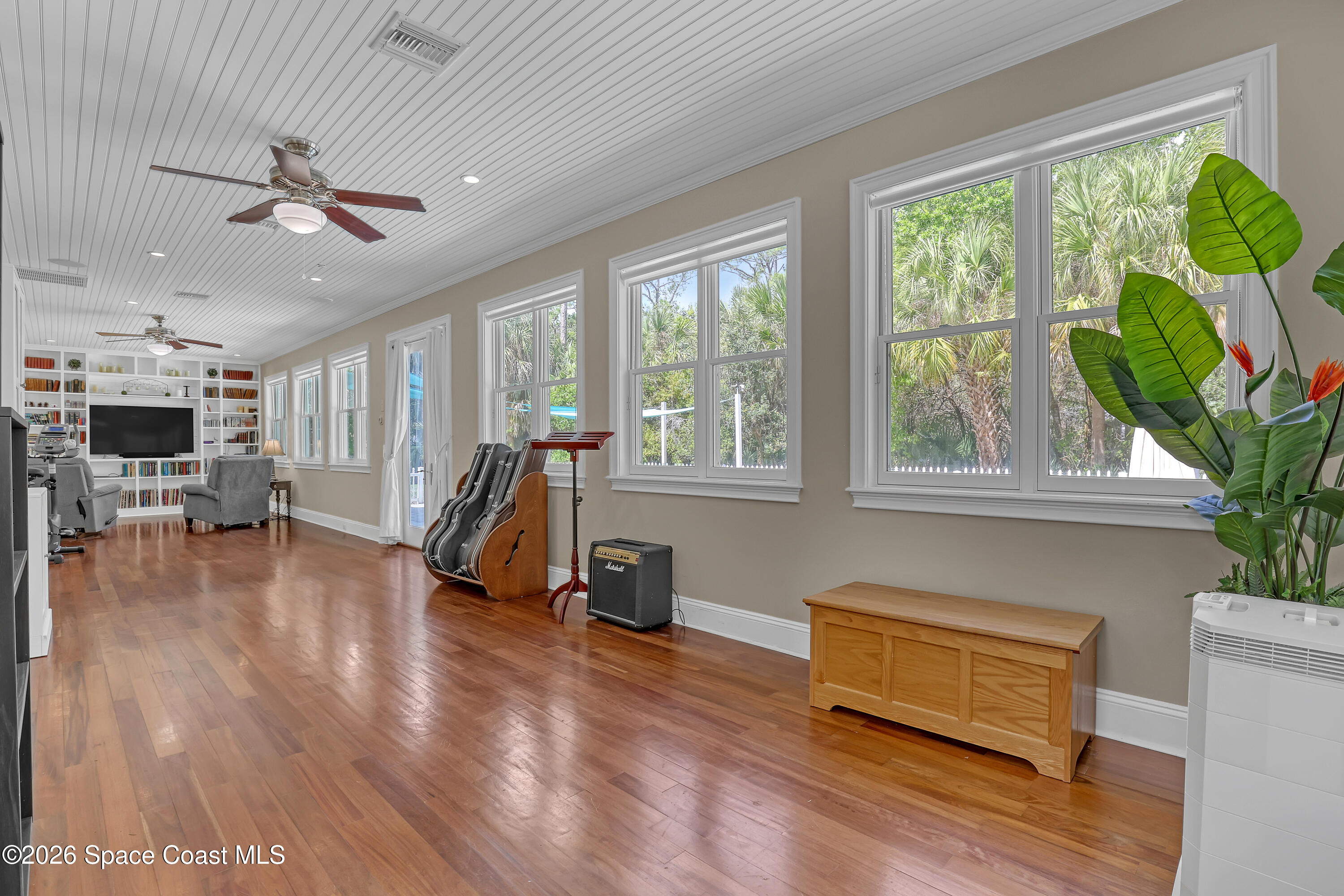 4200 Mustang Road Melbourne, FL 32934 - Photo 26 of 58 a living room with furniture and a wooden floor
