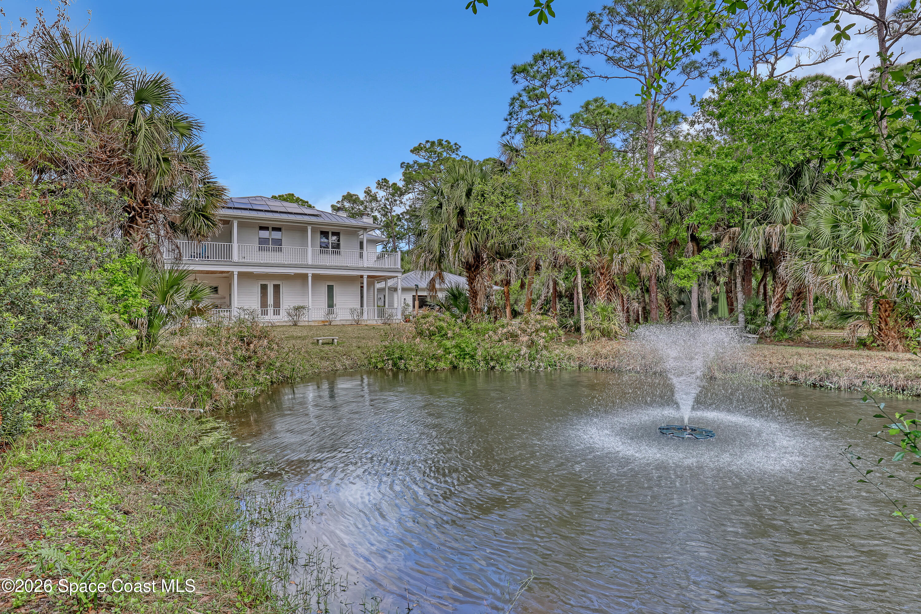 4200 Mustang Road Melbourne, FL 32934 - Photo 3 of 58 a backyard of a house with lots of green space