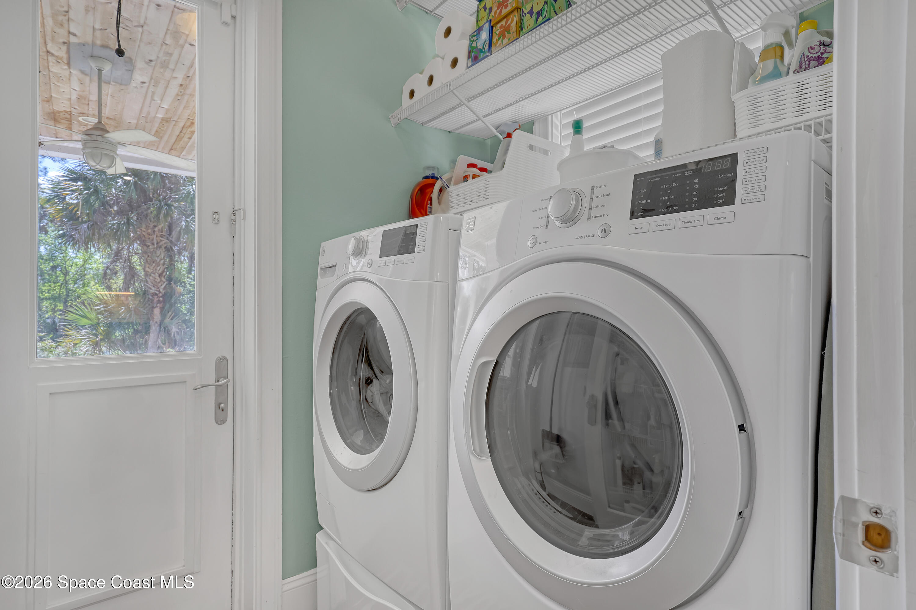 4200 Mustang Road Melbourne, FL 32934 - Photo 33 of 58 a utility room with dryer and washer
