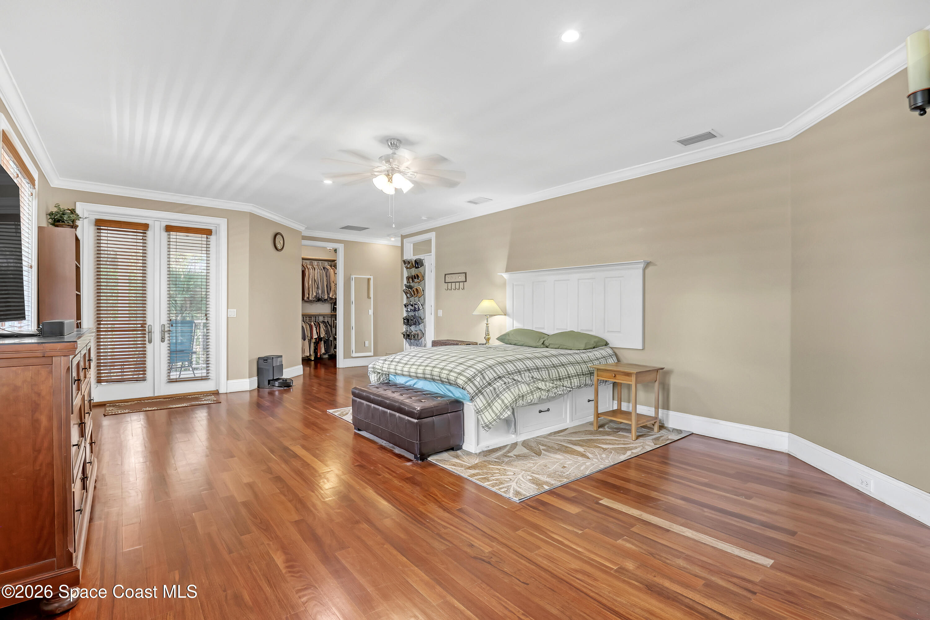4200 Mustang Road Melbourne, FL 32934 - Photo 34 of 58 a living room with a bed furniture and a large window