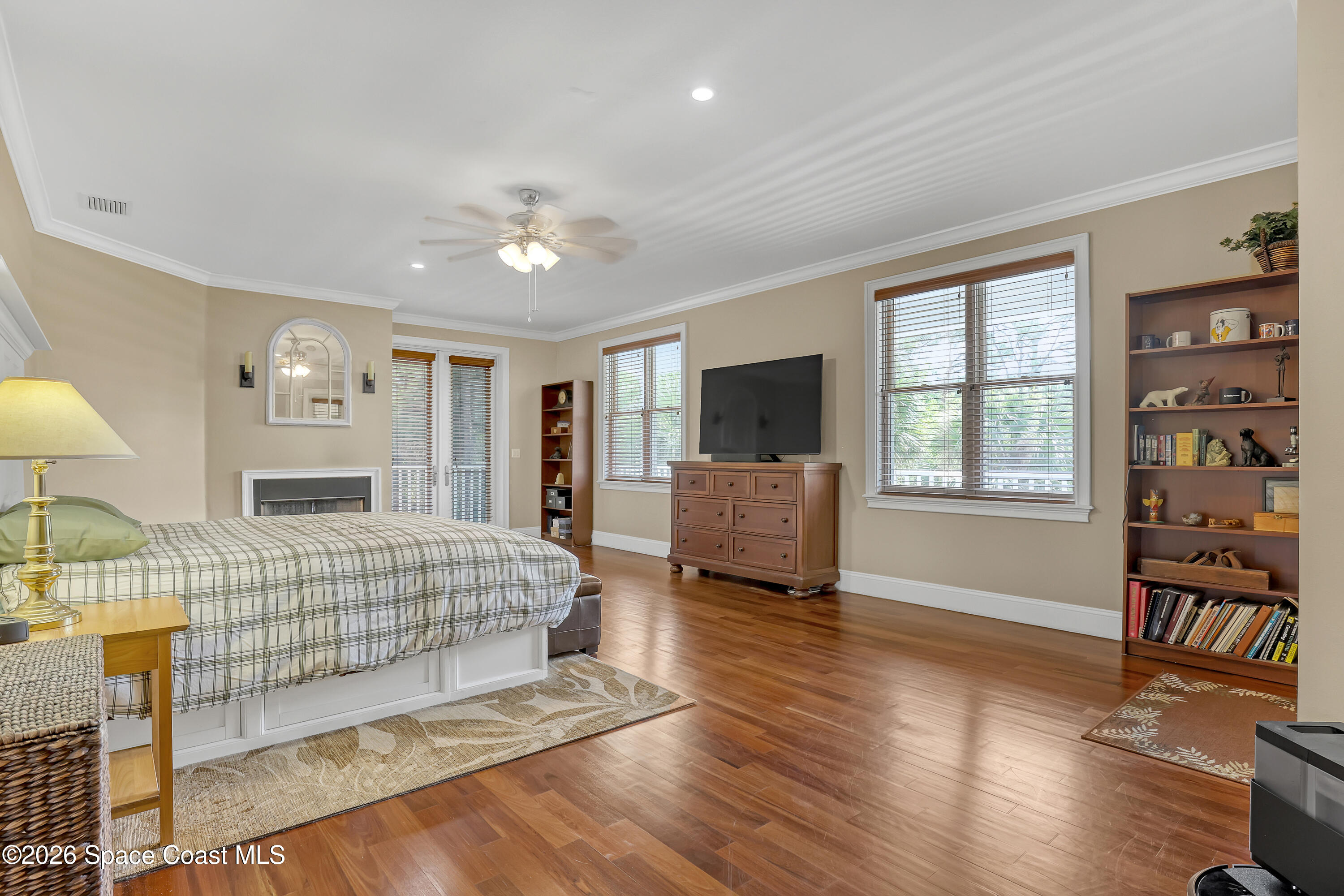 4200 Mustang Road Melbourne, FL 32934 - Photo 35 of 58 a spacious bedroom with a bed and wooden floor