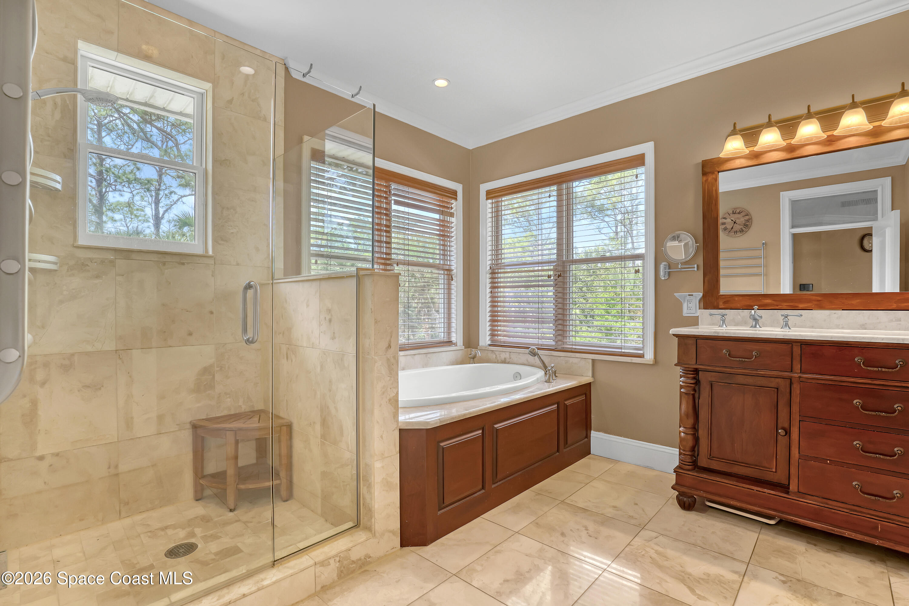 4200 Mustang Road Melbourne, FL 32934 - Photo 39 of 58 a bathroom with a tub sink and mirror