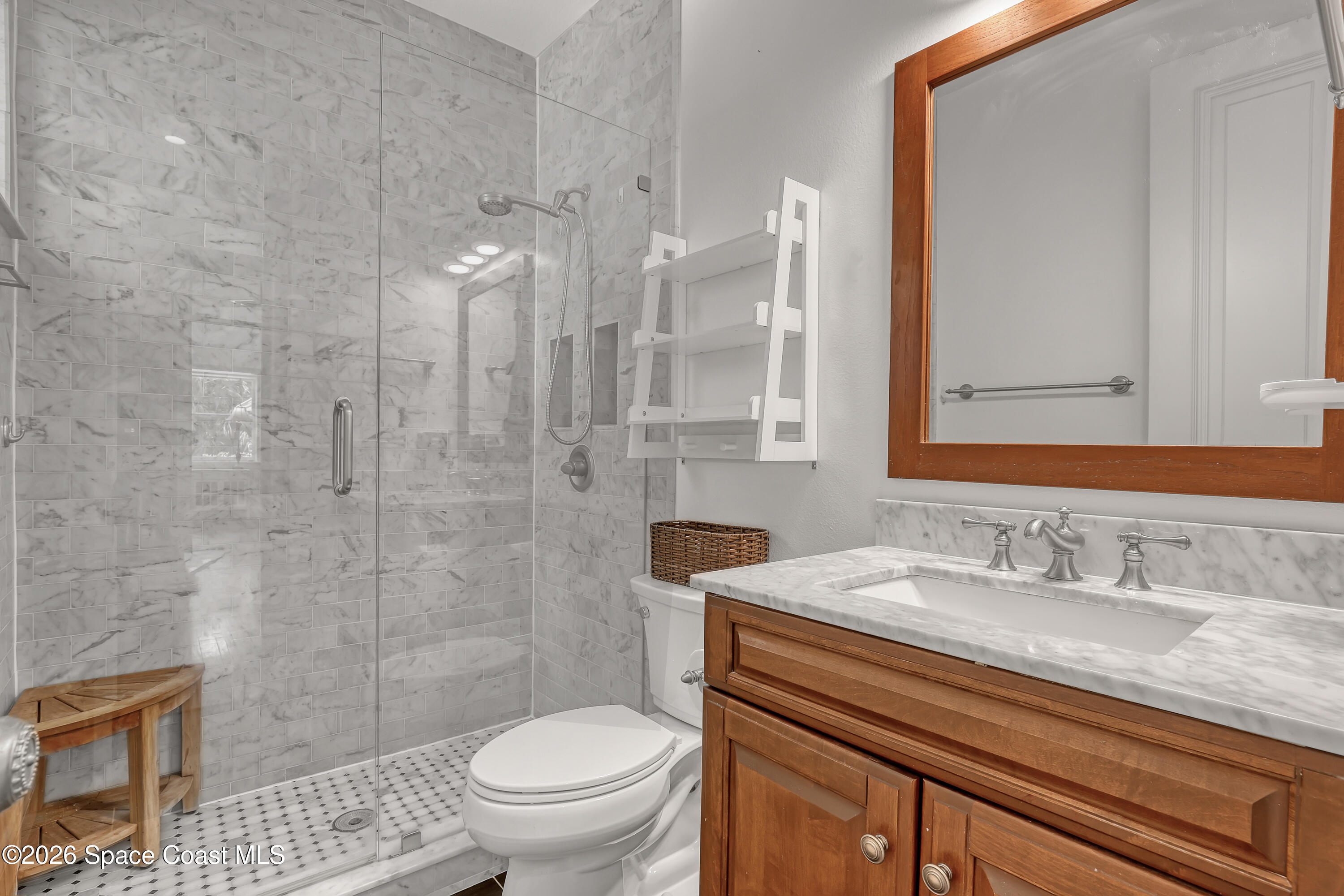 4200 Mustang Road Melbourne, FL 32934 - Photo 43 of 58 a bathroom with a sink a toilet and shower