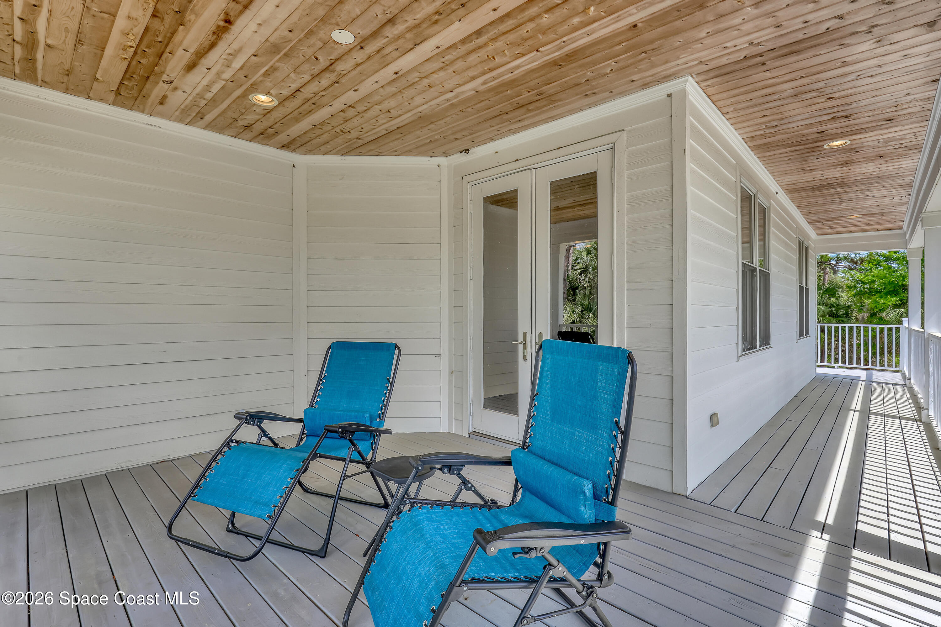 4200 Mustang Road Melbourne, FL 32934 - Photo 45 of 58 a view of a chairs in wooden deck