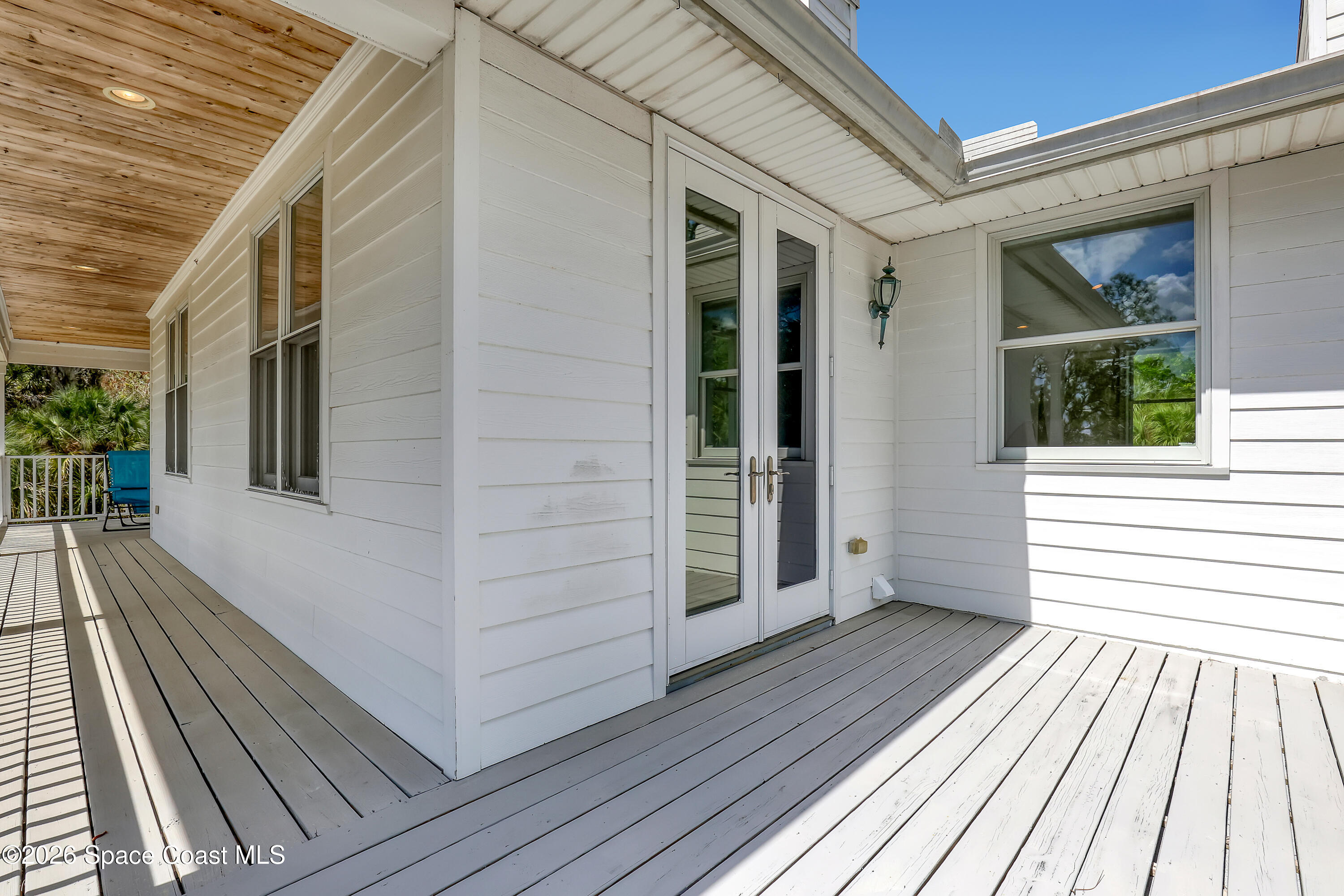 4200 Mustang Road Melbourne, FL 32934 - Photo 46 of 58 a view of a house with a door and wooden floor
