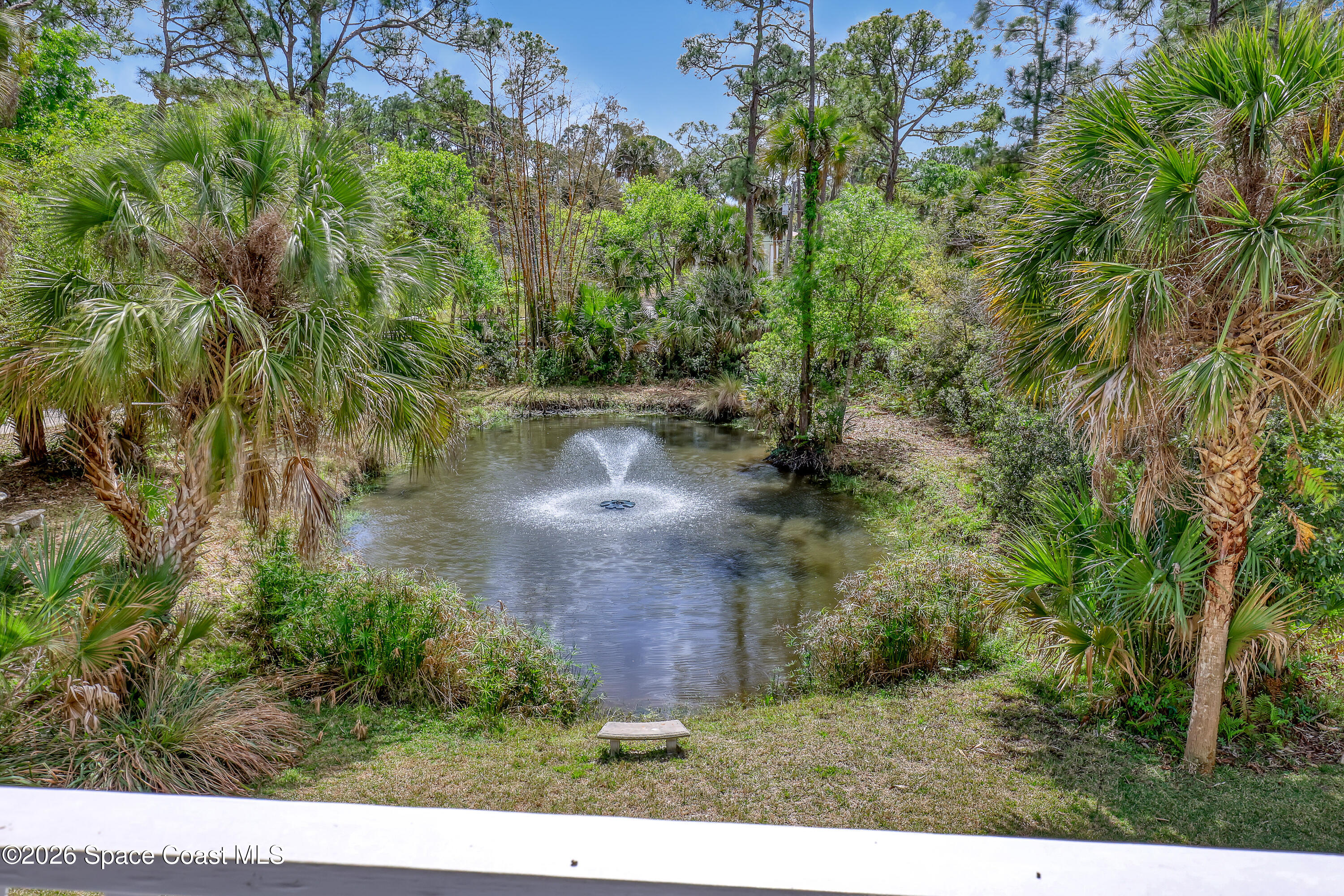 4200 Mustang Road Melbourne, FL 32934 - Photo 47 of 58 a view of a lake with a yard