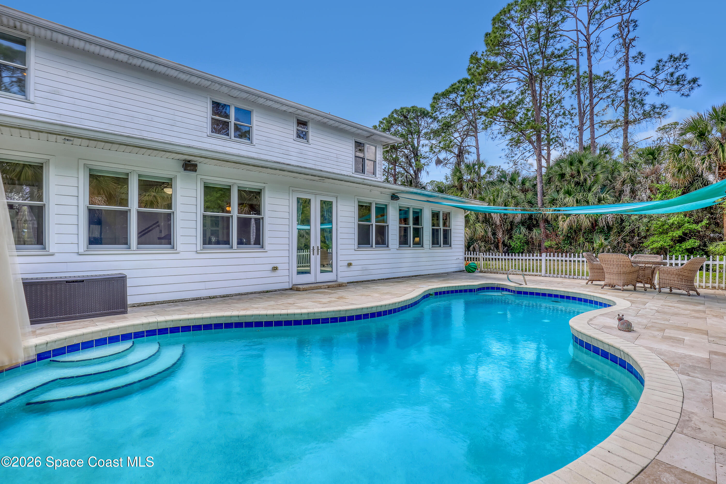 4200 Mustang Road Melbourne, FL 32934 - Photo 50 of 58 a view of a house with swimming pool and porch