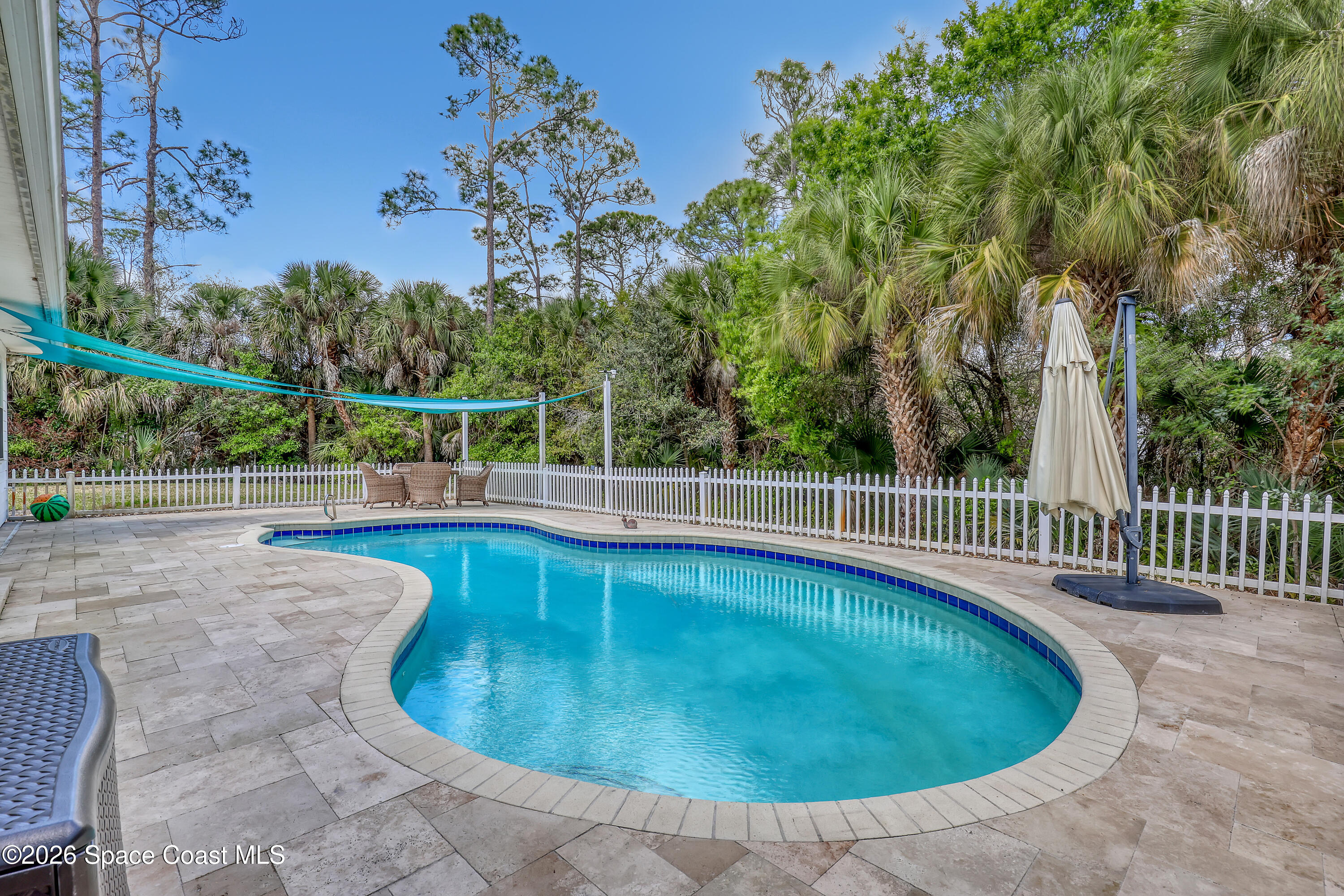 4200 Mustang Road Melbourne, FL 32934 - Photo 51 of 58 a view of a swimming pool with a patio