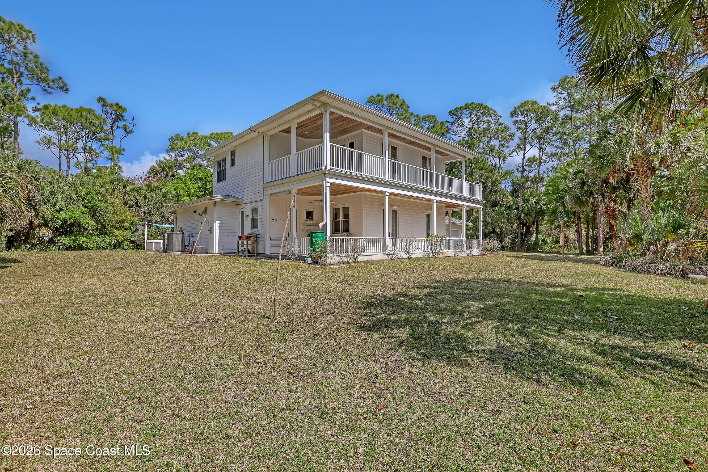 4200 Mustang Road Melbourne, FL 32934 - Photo 9 of 58 a front view of a house with a yard