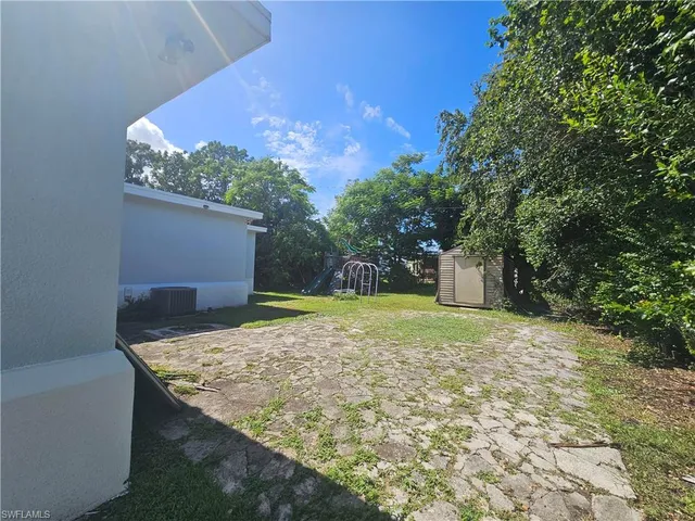 a backyard of a house with lots of green space