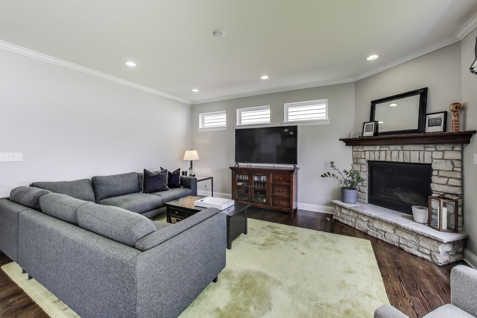 557 North Myrtle Avenue Elmhurst, IL 60126 - Photo 11 of 33 a living room with furniture a flat screen tv and a fireplace