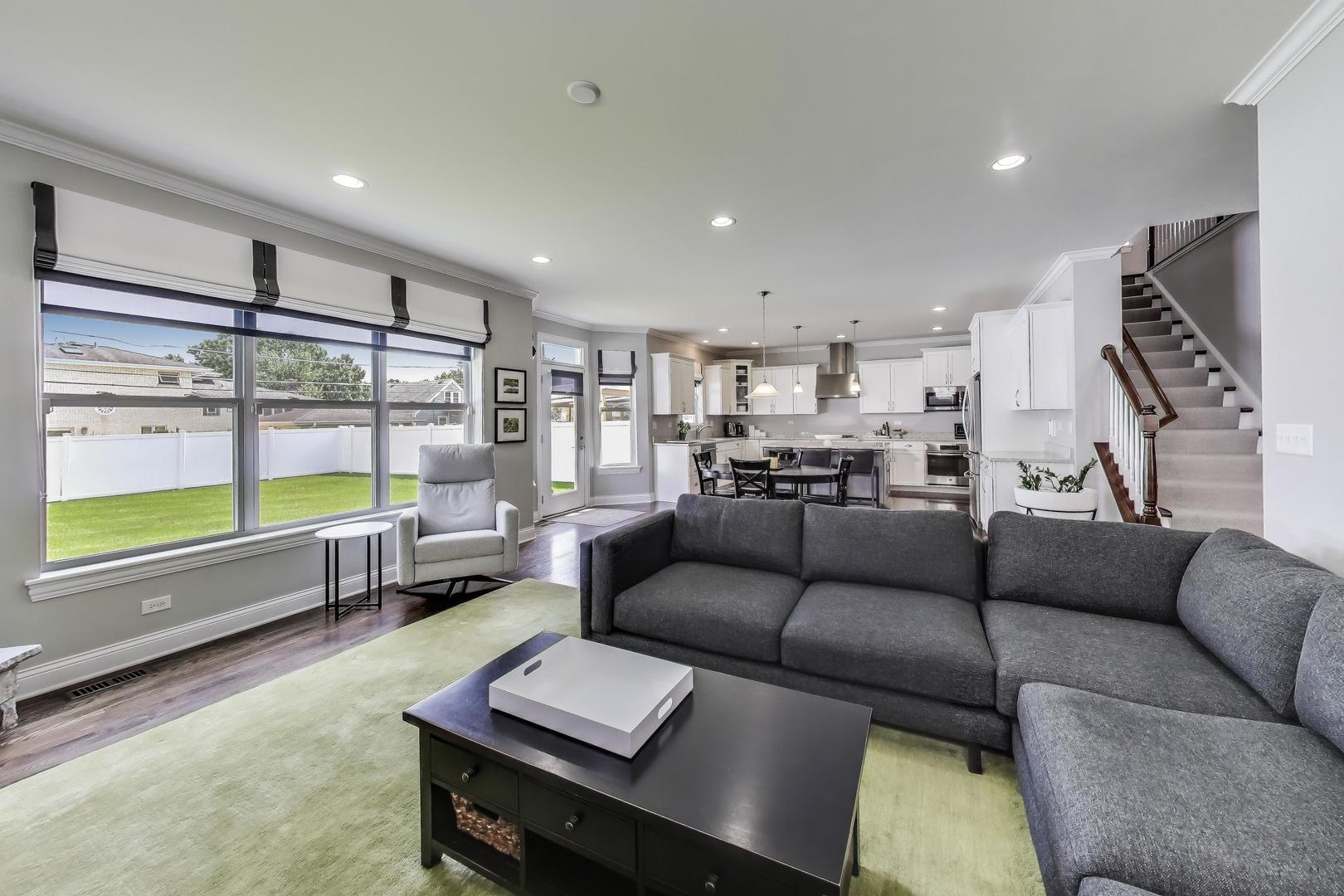 557 North Myrtle Avenue Elmhurst, IL 60126 - Photo 12 of 33 a living room with furniture and a flat screen tv