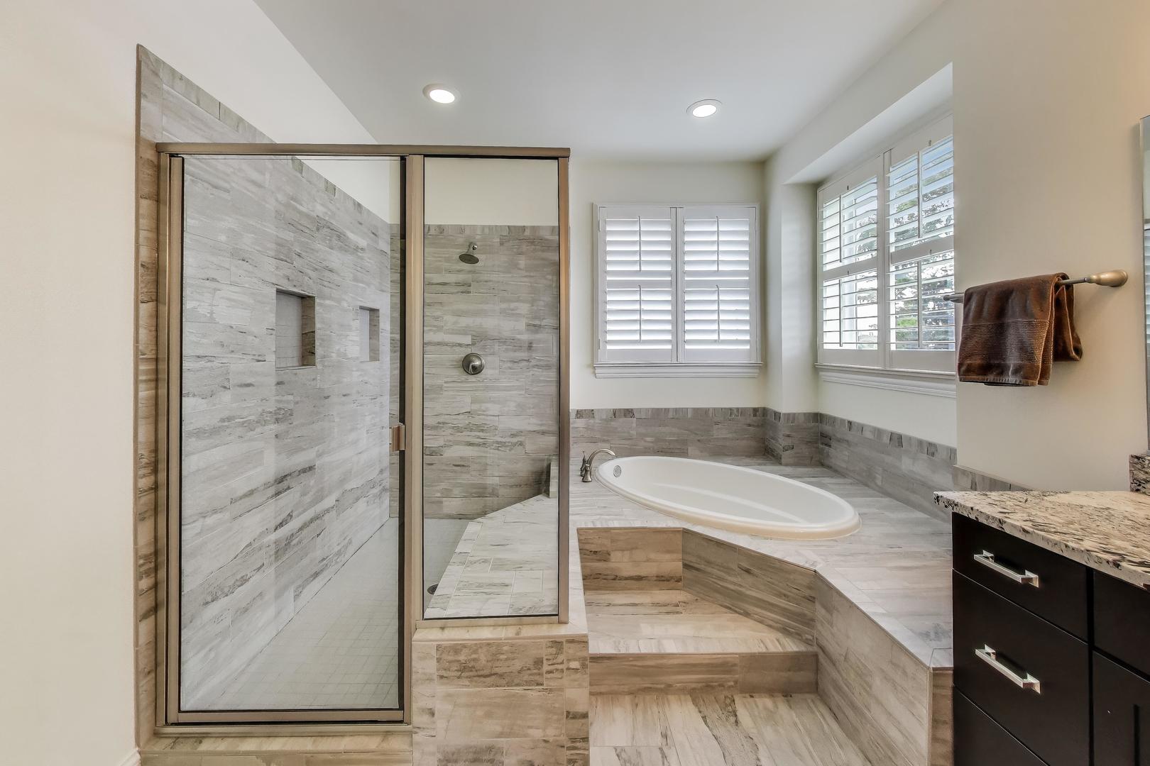 557 North Myrtle Avenue Elmhurst, IL 60126 - Photo 21 of 33 a spacious bathroom with a granite countertop sink a mirror and shower