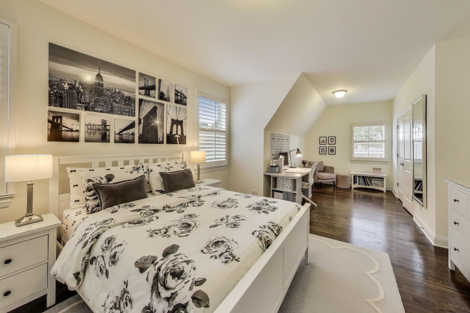 557 North Myrtle Avenue Elmhurst, IL 60126 - Photo 23 of 33 a large bedroom with a bed and wooden floor