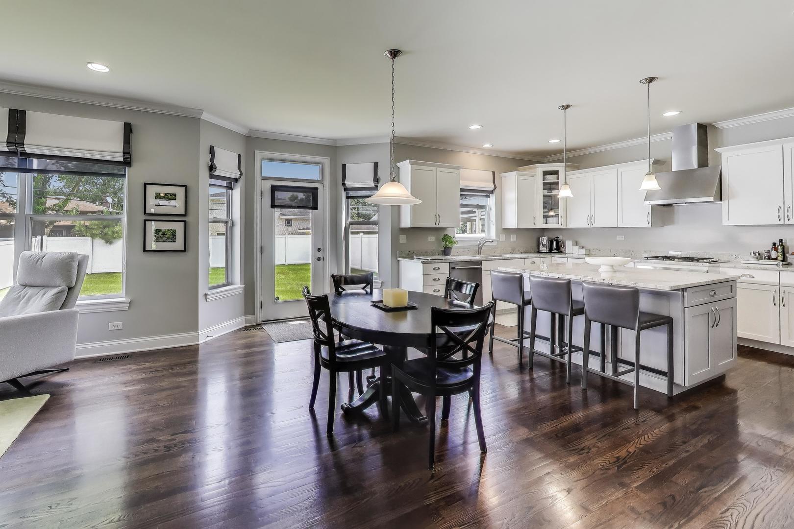 557 North Myrtle Avenue Elmhurst, IL 60126 - Photo 9 of 33 a view of a dining room with furniture window and wooden floor
