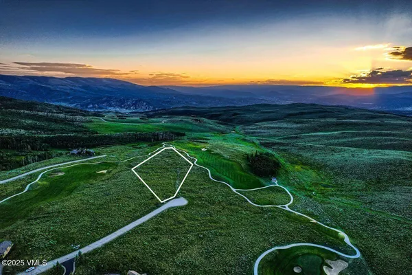 a view of a golf course with a swimming pool