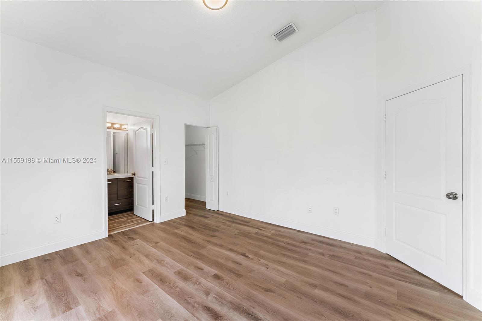 17767 Southwest 144th Avenue Miami, FL 33177 - Photo 11 of 21 a view of livingroom with hallway