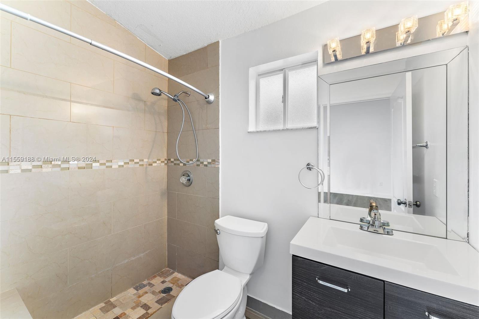 17767 Southwest 144th Avenue Miami, FL 33177 - Photo 13 of 21 a bathroom with a sink toilet and shower