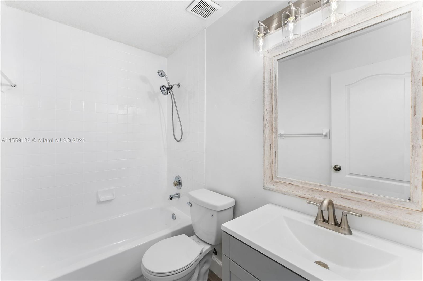 17767 Southwest 144th Avenue Miami, FL 33177 - Photo 18 of 21 a bathroom with a sink toilet and shower