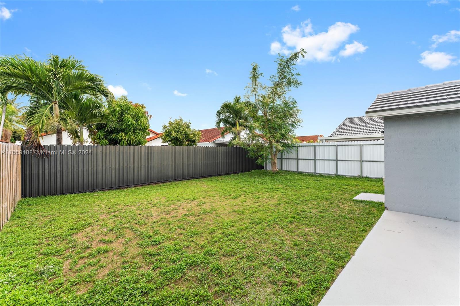 17767 Southwest 144th Avenue Miami, FL 33177 - Photo 19 of 21 a view of a backyard with a garden