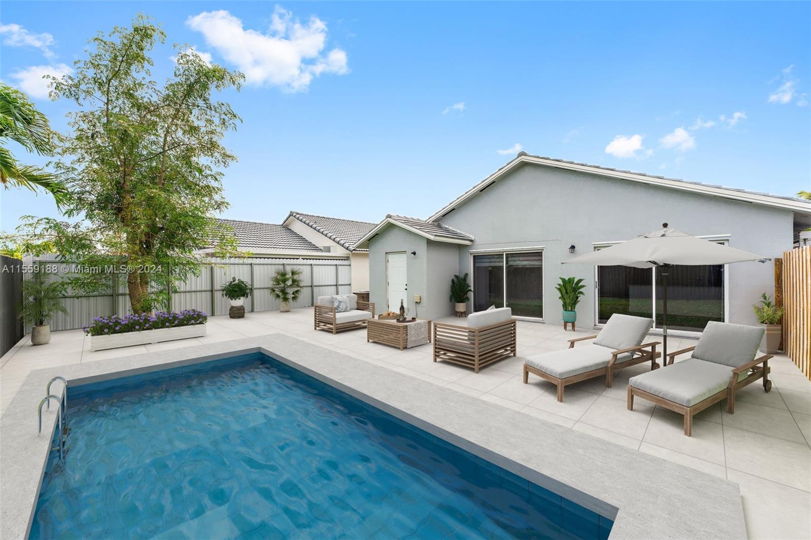 17767 Southwest 144th Avenue Miami, FL 33177 - Photo 21 of 21 a view of a house with backyard and sitting area