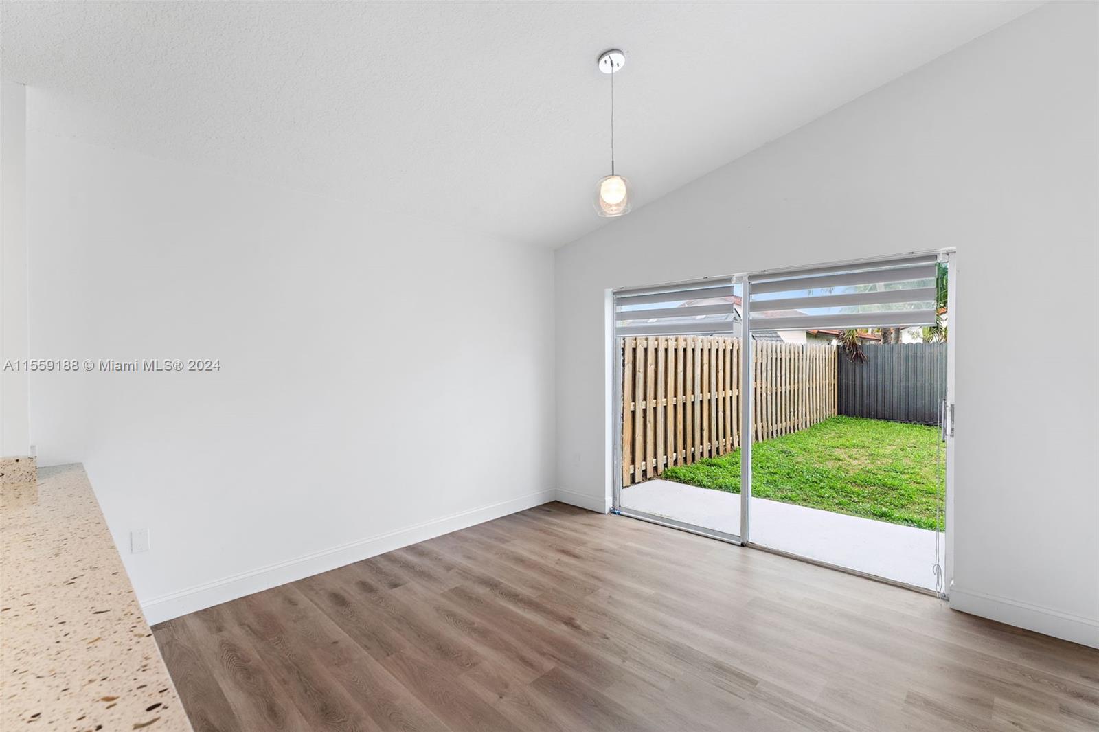 17767 Southwest 144th Avenue Miami, FL 33177 - Photo 7 of 21 a view of an empty room with floor to ceiling window