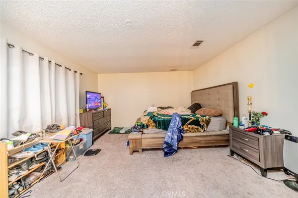 a bed room with furniture and a couch