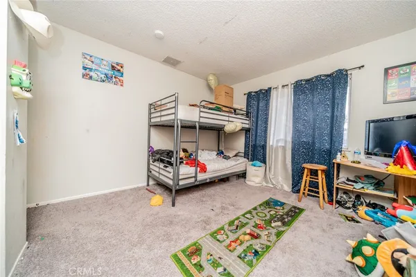 a children room with furniture and toys