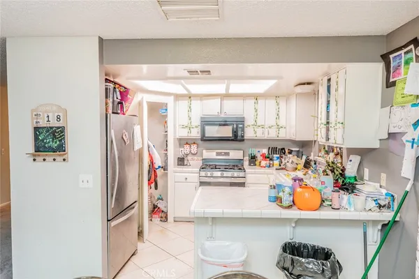 a kitchen with stainless steel appliances a refrigerator and sink
