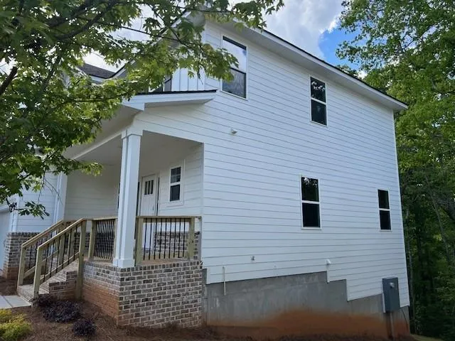 a view of a house with a small yard