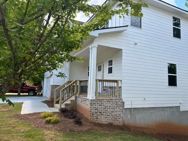 a view of front of house with a yard