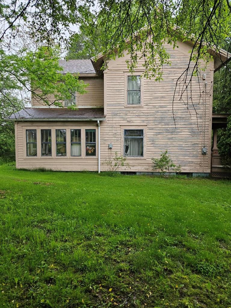 1067 Perryville Road Parker, PA 16049 - Photo 3 of 8 a view of a house with backyard and garden