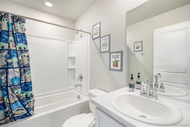 a bathroom with a sink a toilet and a bathtub